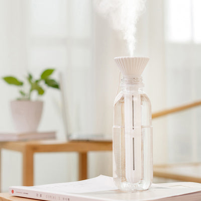 Beige and white USB ultrasonic humidifier with a fluted conical top and a cylindrical body with a water level window. - Image 8