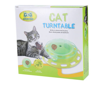 Green and yellow two-tier interactive cat toy turntable with a bell ball in the track and kibble in the top compartment. - Image 9