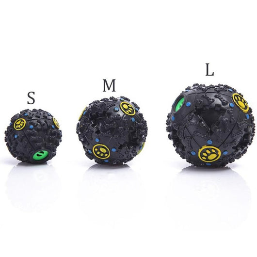 Black treat-dispensing dog toy ball with textured bone shapes, blue dots, and a yellow paw print logo. - Image 3