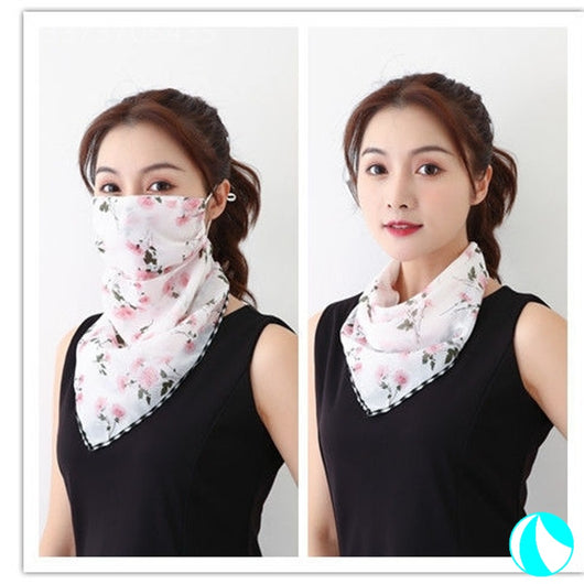 White women's UV protection scarf with black speckle pattern, worn as a face mask and neck scarf. - Image 17