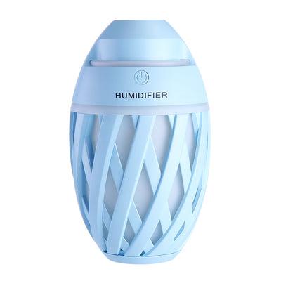 Light green football-shaped humidifier with a decorative lattice pattern and a power button on top. - Image 24