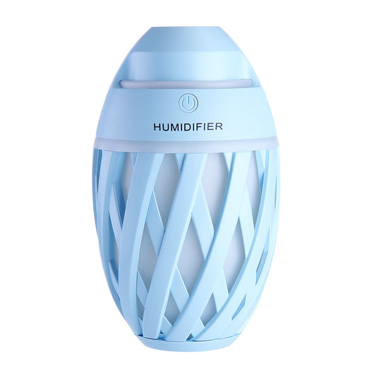 Light green football-shaped humidifier with a decorative lattice pattern and a power button on top. - Image 24