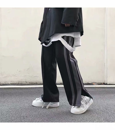 Pantalones deportivos de pierna ancha con abertura