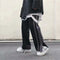 Pantalones deportivos de pierna ancha con abertura