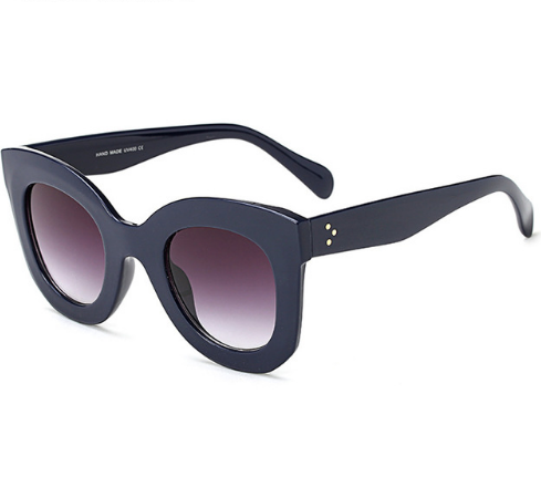 Transparent pink cat-eye sunglasses with gradient gray lenses, featuring a thick frame and vintage style. - Image 6