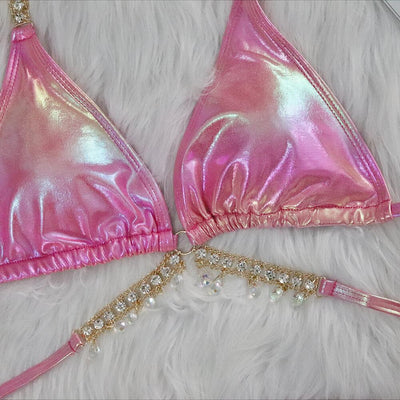 Iridescent purple and pink two-piece bikini with gold-toned crystal embellishments on a white faux fur background. - Image 4