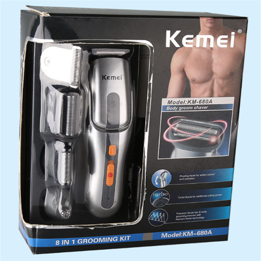 Kemei multi-function hair clipper set with silver and black body, orange buttons, and multiple interchangeable heads on a black charging base. - Image 6