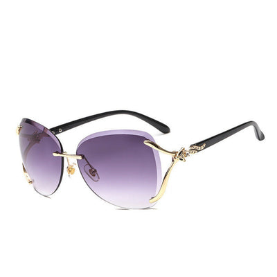 Oversized rimless sunglasses with gradient gray lenses and silver-tone metal accents, displayed on a white surface. - Image 4