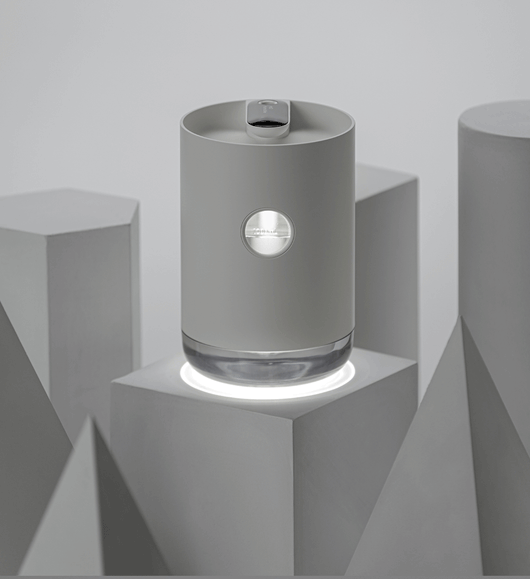 White cylindrical humidifier with a transparent base, digital display, and 1000ml capacity indicator. - Image 4