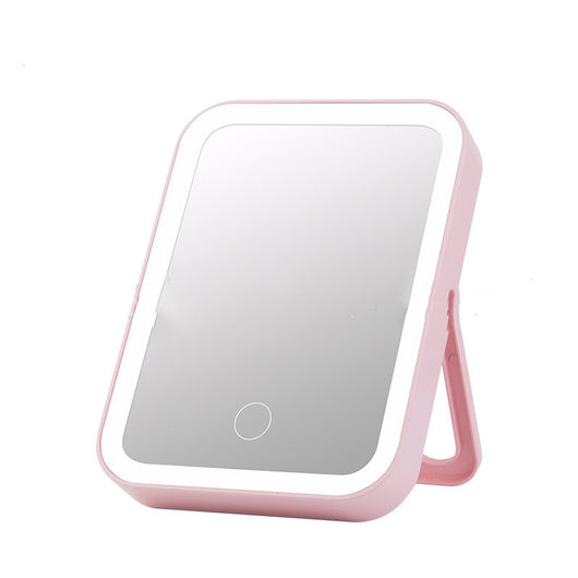 Pink LED makeup mirror with a rectangular shape, built-in lights, and a touch-sensitive power button. - Image 5