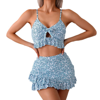 Women's blue and white floral print two-piece set with ruffled crop top and matching mini skirt. - Image 5