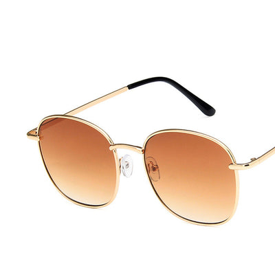 Gold metal round sunglasses with dark gray resin lenses and black temple tips on a white background. - Image 7