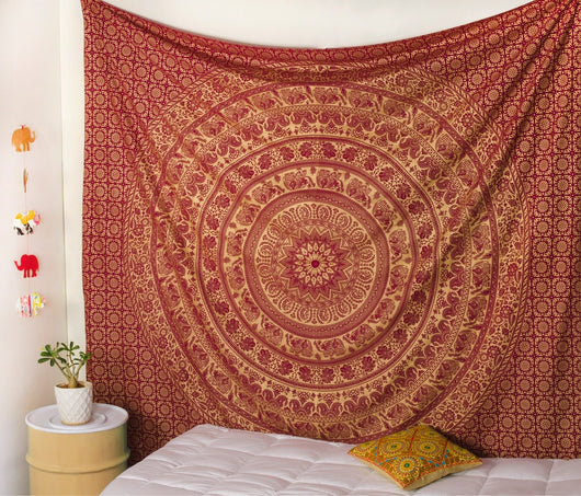 Gold and blue mandala tapestry with elephant and floral patterns, hung above a white quilted bed. - Image 3