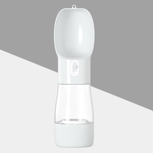 White and clear portable dog water dispenser with a built-in bowl and transparent water reservoir. - Image 8