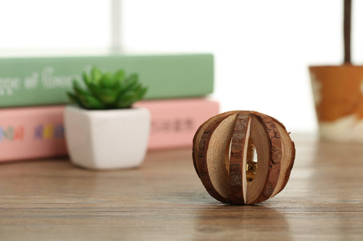 Set of natural wooden hamster toys including dumbbell shapes, a spherical bell toy, and two cylindrical bell toys, with a hamster. - Image 14