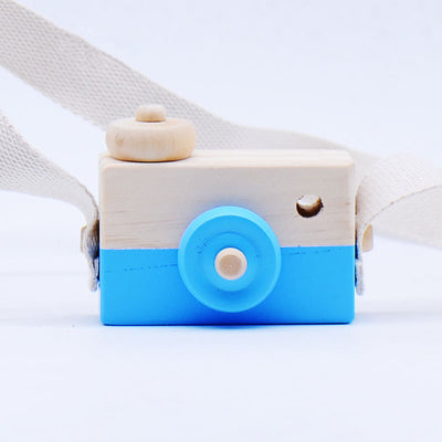 Two-tone wooden toy camera in natural wood and light blue with a cream fabric strap, for babies and kids. - Image 3