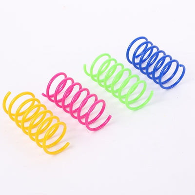 Colorful plastic spring cat toys in pink, yellow, green, and blue, packaged in a clear plastic bag. - Image 9