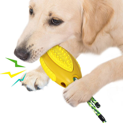 Yellow dog toy with textured surface and braided rope handle, held by a light-colored dog. - Image 8