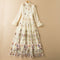 Vestido Largo Elegante con Cuello Alto, Bordado en Malla y Dobladillo Ancho