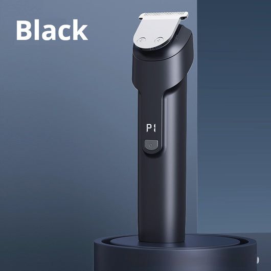 White electric hair clipper with a black top, silver blade, digital display, and power button on a dark base. - Image 4