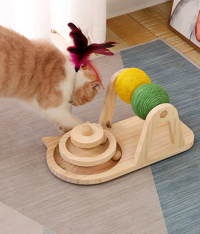 Solid wood cat toy with a tiered ball track, a spring-loaded feather wand, and green and yellow sisal rollers. - Image 4