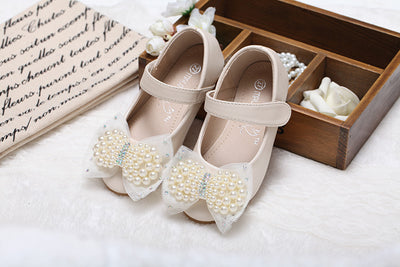 Beige girls' princess shoes with pearl and rhinestone bows, featuring a flat heel and a convenient Velcro strap. - Image 21