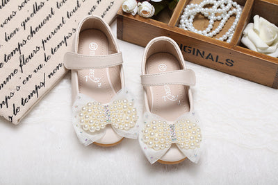 Beige girls' princess shoes with pearl and rhinestone bows, featuring a flat heel and a convenient Velcro strap. - Image 25