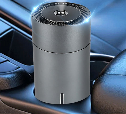 Black cylindrical vehicular humidifier with a silver trim and a vertical indicator light on a white background. - Image 7