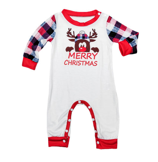 Young girl in a white long-sleeve Christmas pajama top with a reindeer graphic and red plaid pajama pants. - Image 7