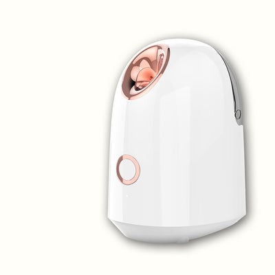 White and rose gold steam facial sprayer emitting warm mist, shown on a light wooden table. - Image 3