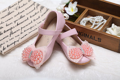 Beige girls' princess shoes with pearl and rhinestone bows, featuring a flat heel and a convenient Velcro strap. - Image 13