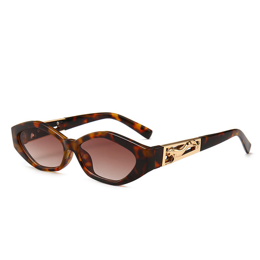 Angular cat-eye sunglasses with a tortoiseshell frame, brown gradient lenses, and gold jumping cheetah temple details. - Image 9