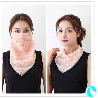 White women's UV protection scarf with black speckle pattern, worn as a face mask and neck scarf. - Image 12
