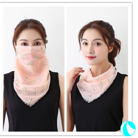 White women's UV protection scarf with black speckle pattern, worn as a face mask and neck scarf. - Image 12