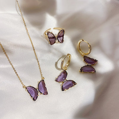 Aretes, Anillo y Collar de Cristal Púrpura con Diseño de Mariposa - Image 2