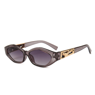 Angular cat-eye sunglasses with a tortoiseshell frame, brown gradient lenses, and gold jumping cheetah temple details. - Image 8