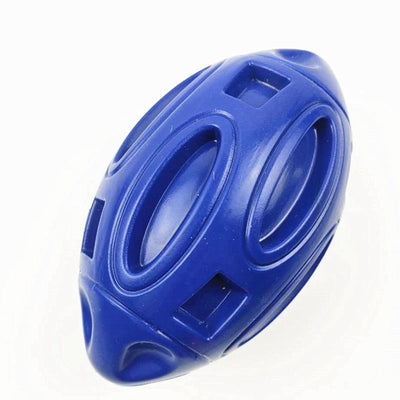 Green rubber rugby-shaped dog toy with textured surface and cut-outs, designed for chewing and play. - Image 16
