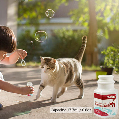 Bioline Catnip Bubbles bottle with a red label, featuring a cat silhouette and text "Safe and non-toxic. Natural Catnip oil 17.7ml". A white bubble wand is next - Image 4