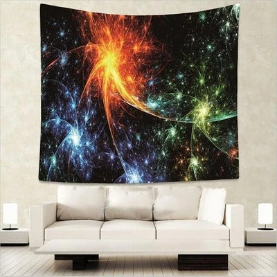 Solar Flare Wall Tapestry with vibrant orange, yellow, blue, and green abstract patterns on a black background, hanging above a white sofa. - Image 2
