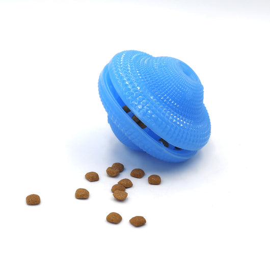 Blue TPR pet toy ball with textured surface, designed for food dispensing and molar training, with kibble scattered around. - Image 6