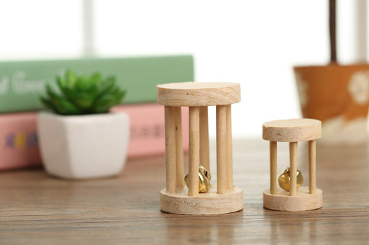 Set of natural wooden hamster toys including dumbbell shapes, a spherical bell toy, and two cylindrical bell toys, with a hamster. - Image 12