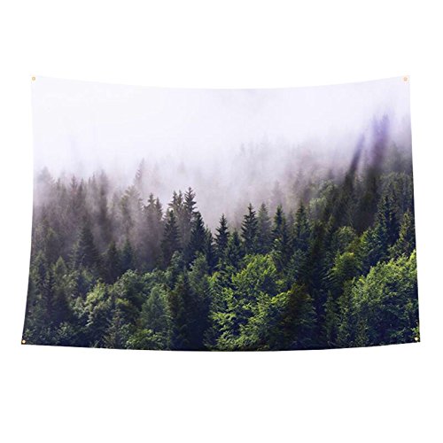 Misty forest tapestry featuring a dense evergreen tree landscape print, with grommets for easy wall hanging.
