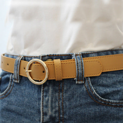 Khaki imitation leather belt with a shiny gold-colored round buckle and visible stitching details. - Image 8