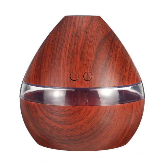 Light wood grain teardrop ultrasonic humidifier and essential oil diffuser with a clear LED light band.