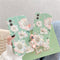 Funda para teléfono con flores y fondo verde