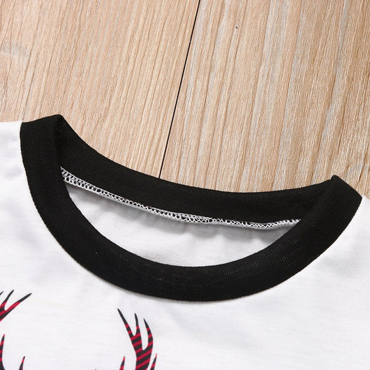 Family matching Christmas pajamas with red and black buffalo plaid pants and white long-sleeve tops featuring a deer graphic and "MERRY CHRISTMAS" text. Include - Image 2
