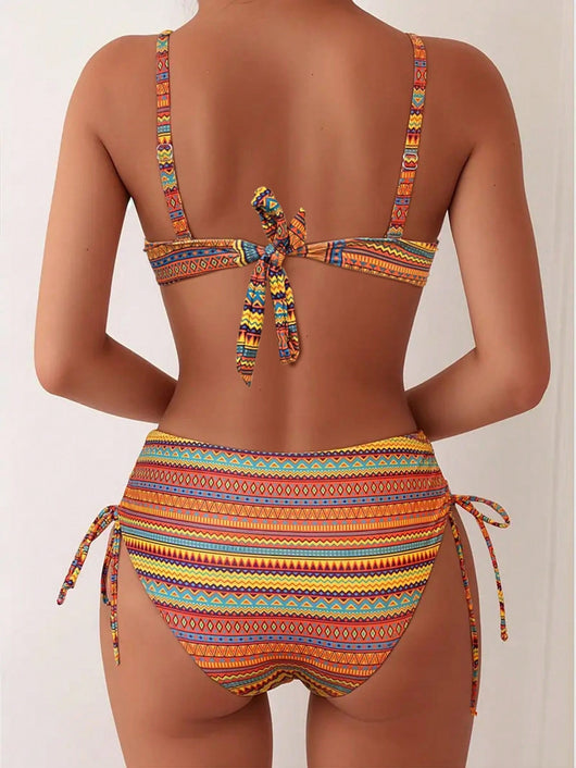 Blue, white, and black geometric print bikini with spaghetti strap bandeau top and high-waisted side-tie bottoms. - Image 17