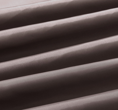 Solid brown polyester shower curtain with metal grommets and hooks, hanging from a silver shower rod. - Image 3