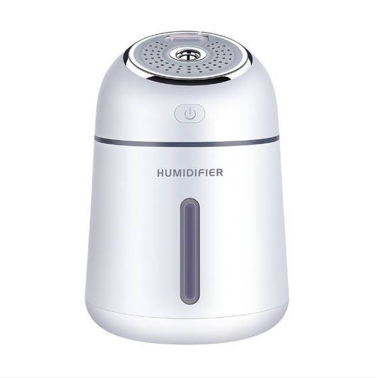 Light blue mini ultrasonic humidifier with a silver top, power button, and clear water level indicator. - Image 7