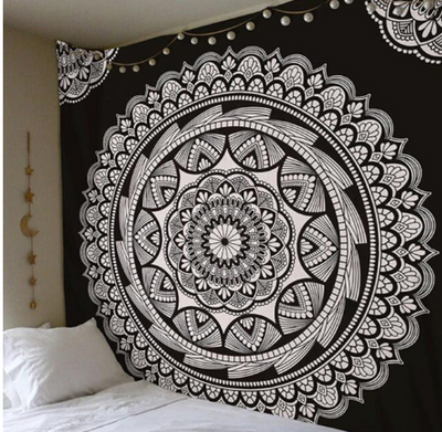 Black and white mandala tapestry with intricate geometric patterns hanging above a bed in a bedroom. - Image 12